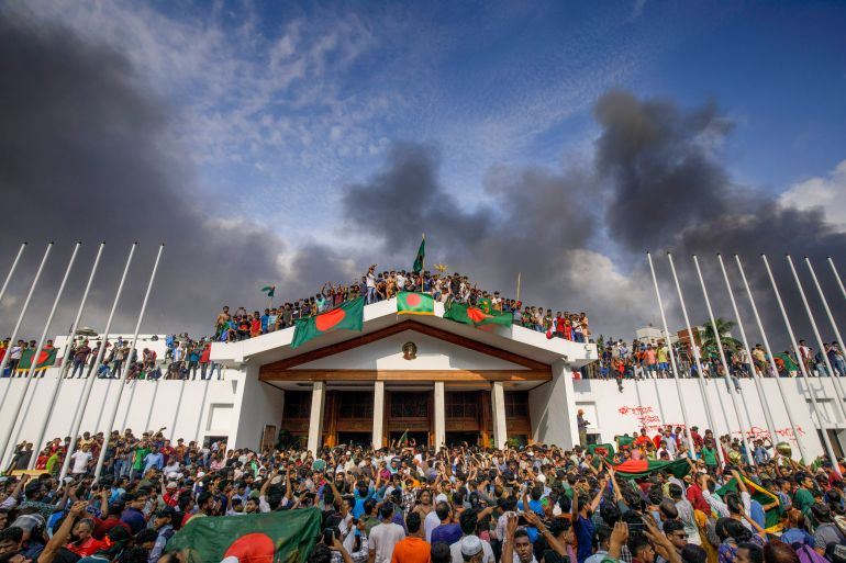 People gather around the residence of Bangladeshi prime minister in Dhaka