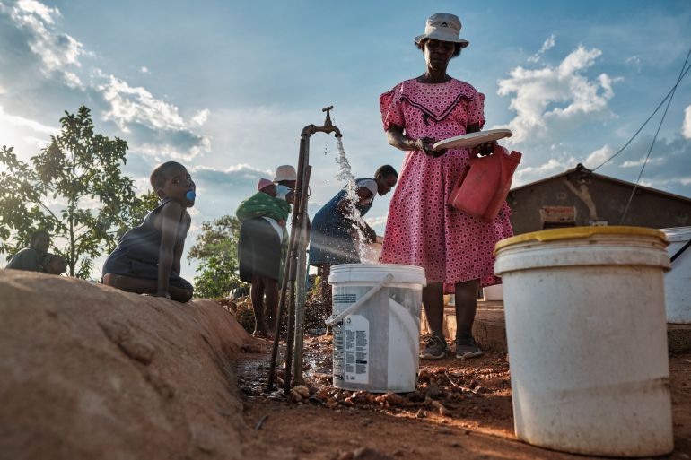 Residents queue for water amid drought in Zimbabwe