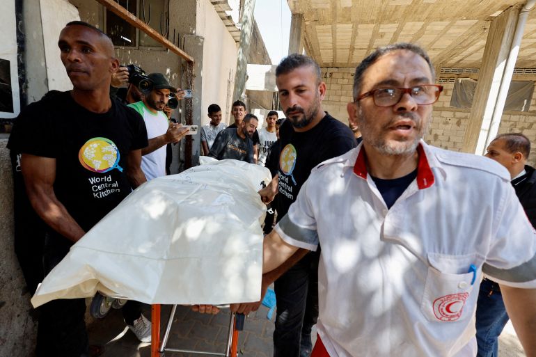 People carry the body of one of the foreign workers from the World Central Kitchen (WCK), who were killed in an Israeli airstrike