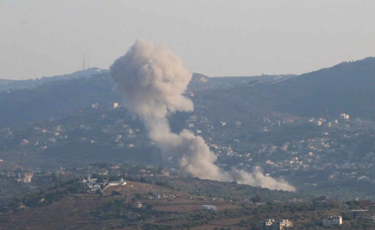 Smoke rises from Kfar Kila, amid cross-border hostilities between Hezbollah and Israeli forces, as pictured from Marjayoun, near the border with Israel, Lebanon