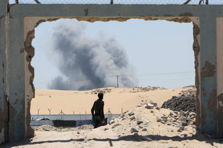 Smoke rises following Israeli strikes, in Khan Younis in the southern Gaza Strip August 8