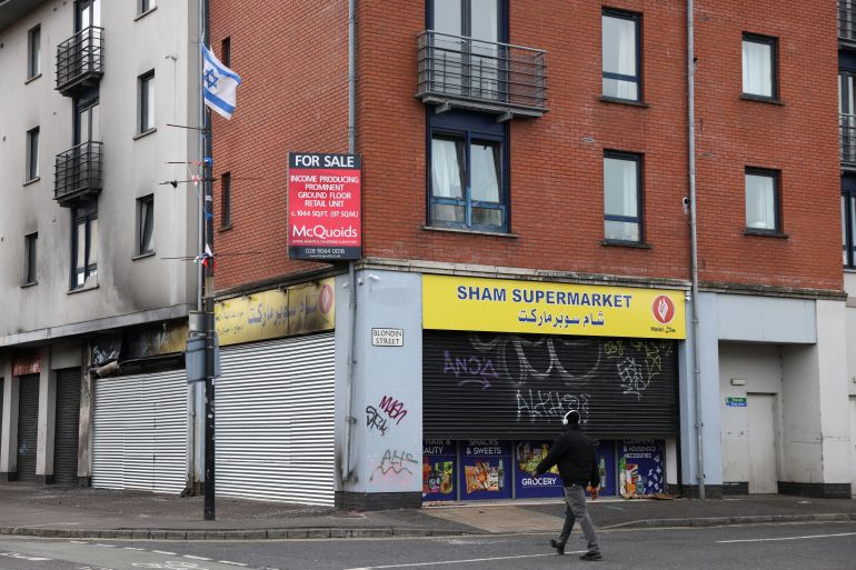 An Israeli flag flies above Sham Supermarket on Donegall Road, a Muslim business that was targeted twice during rioting in Belfast, Northern Ireland, August 11, 2024. REUTERS/Hollie Adams