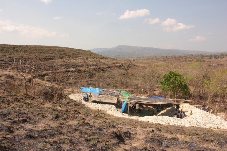 The excavation site at Mata Menge in Indonesia. It is covered with a blue tarpaulin tent.