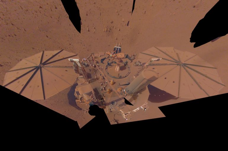 This image provided by NASA shows the InSight Mars lander in a selfie photo composite on April 24, 2022