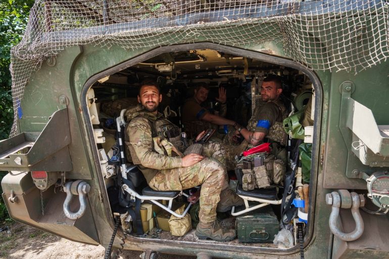 Soldiers in a military vehicle