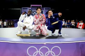 The winners of the men&#039;s Olympics breaking competition: Gold medallist B-Boy Phil Wizard of Team Canada (C), Silver medallist B-Boy Dany Dann of Team France (L) and Bronze medallist B-Boy Victor of Team United States. Many in the breaking community believe their triumphs were overshadowed by the &#039;kangaroo hop&#039; controversy caused by an Australian dancer who received zero points [Elsa/Getty Images]