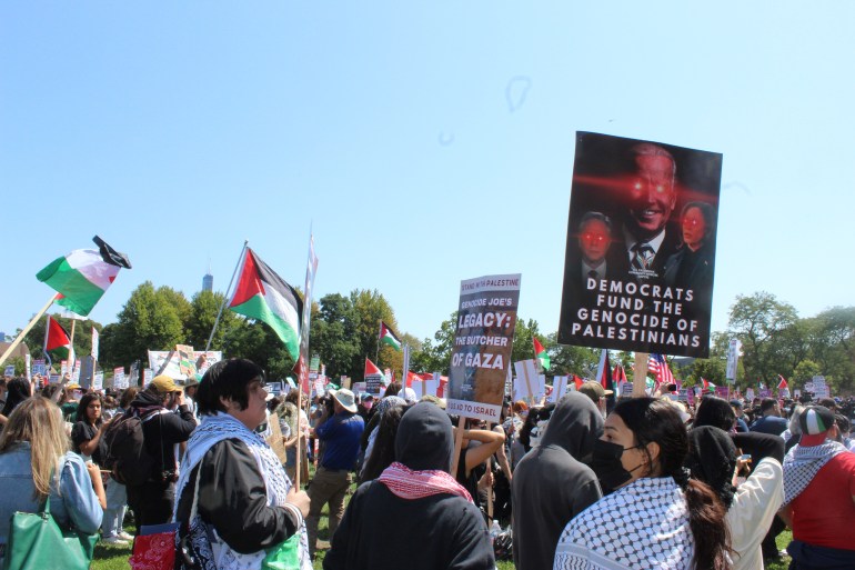 Demonstrators protest against Biden's support of Israel's war of Gaza with signs that read: "Democrats fund the genocide of Palestinians" and "Genocide Joe's legacy: The Butcher of Gaza."